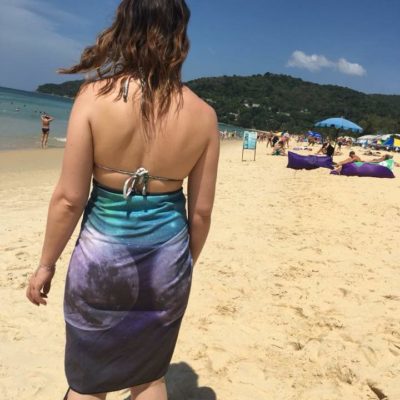 girl with towel wrap at beach