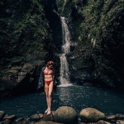 girl with towel at waterfall